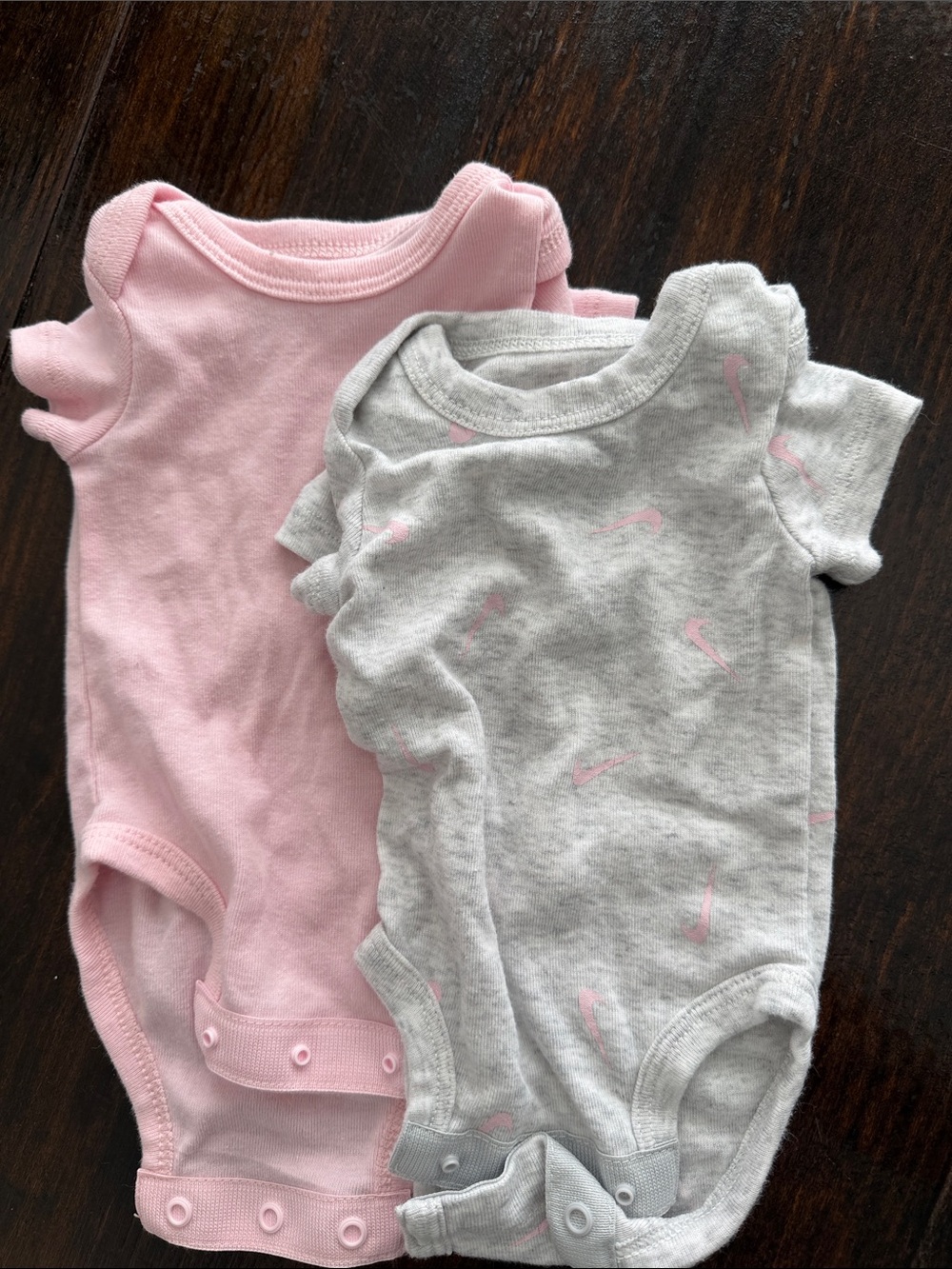 Nike Baby One-Piece Bodysuits in Pink and Light Gray